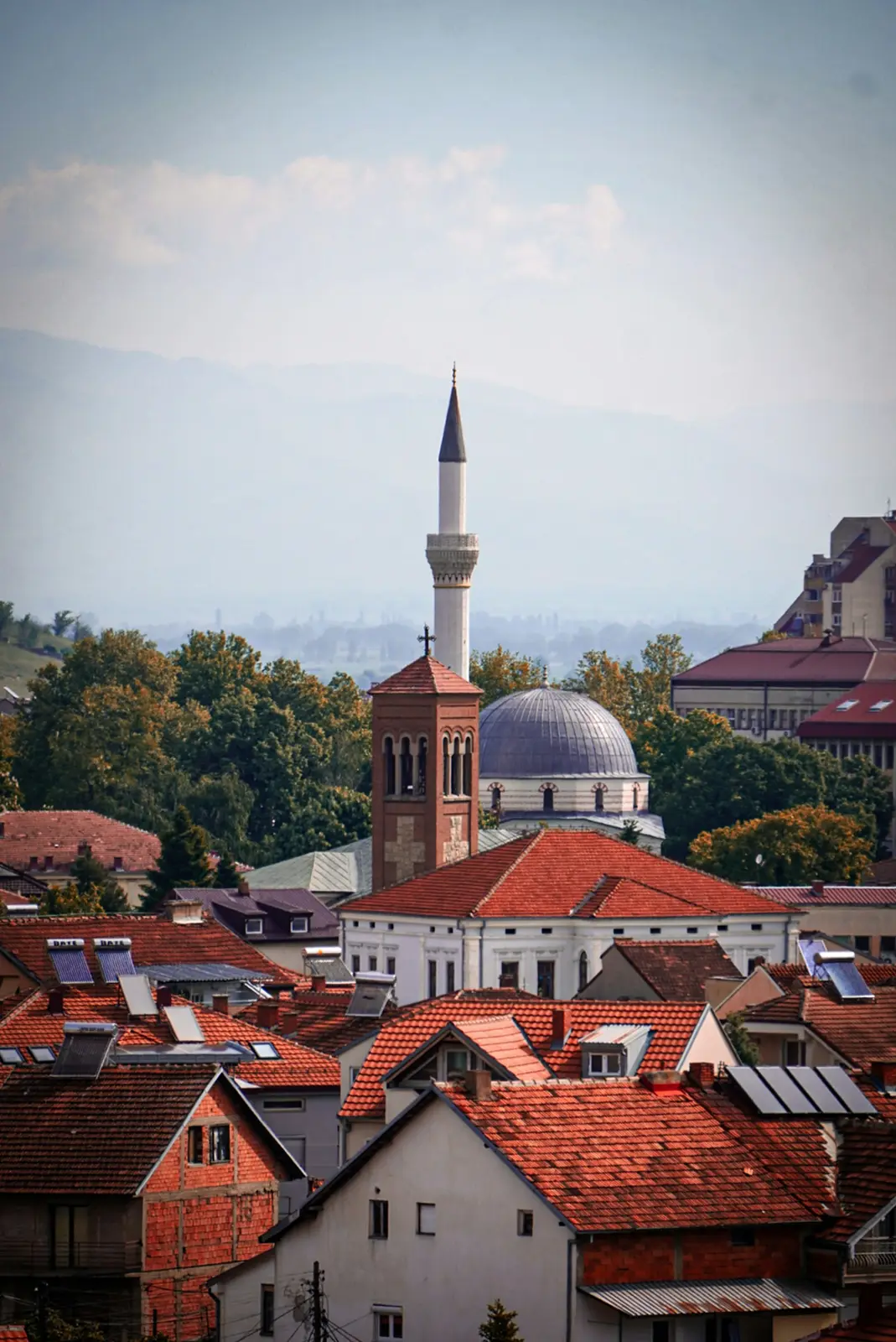 Rooftops of Bitola with a minaret and the mountains behind, North Macedonia